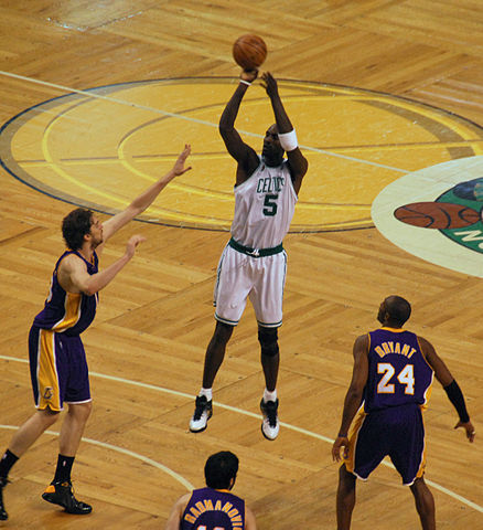 Kevin Garnett (5) attempts a jump shot against Pau Gasol in the 2010 NBA Finals, while Kobe Bryant (24) looks on.